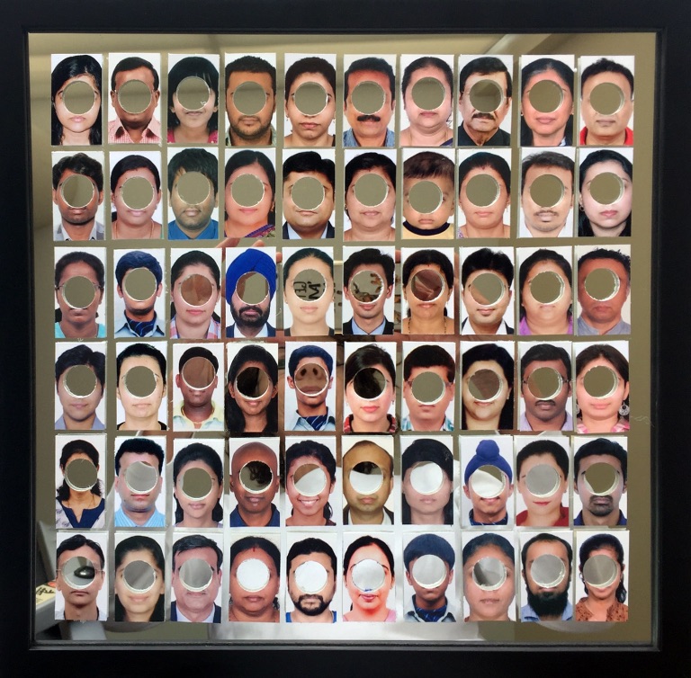 No Visa for you - collage of passport photos over a mirror